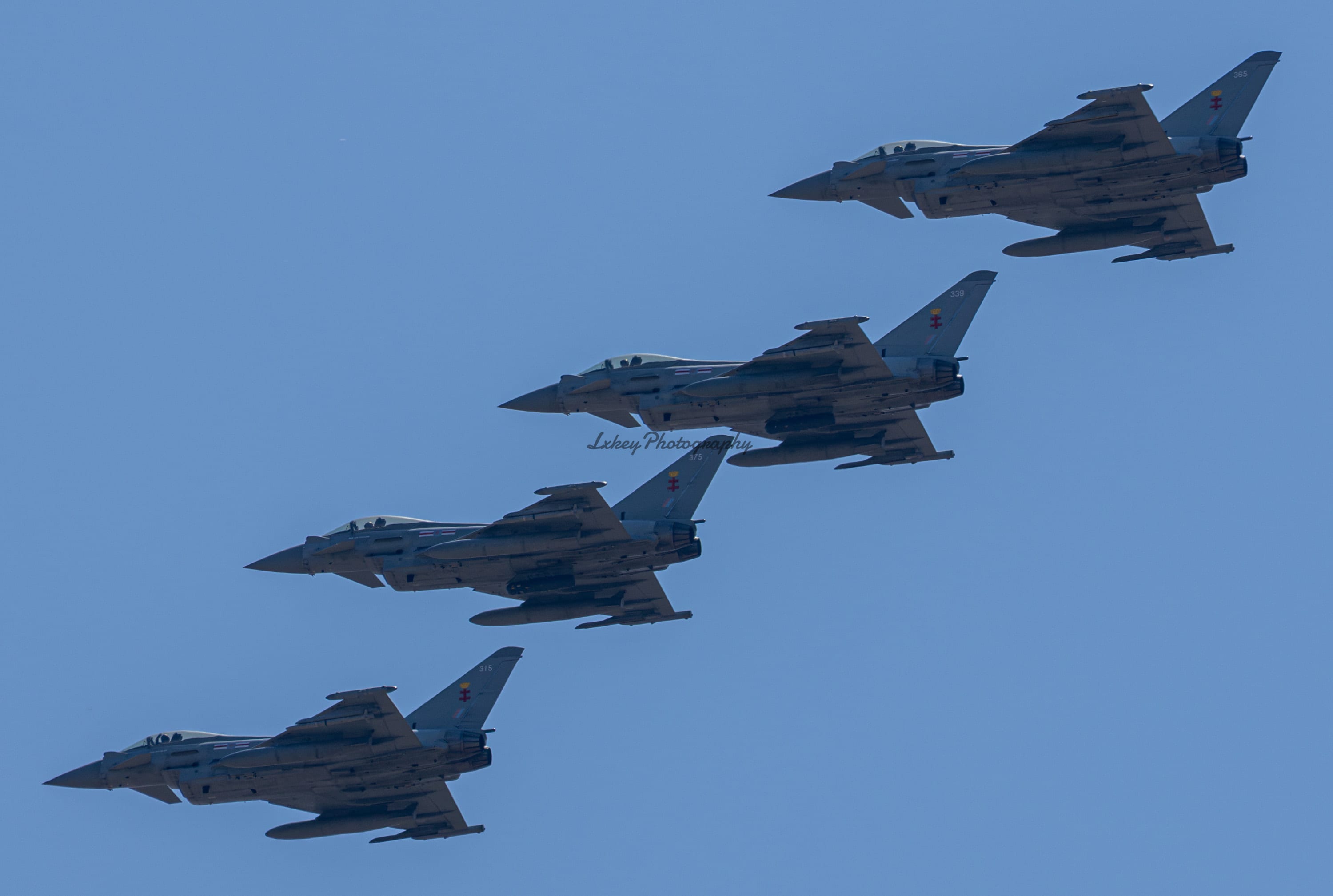 Four Royal Air Force 41 Test and Evaluation Squadron Typhoons flying in echelon formation